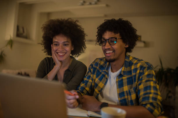 istock Happy couple with laptop 1068767616