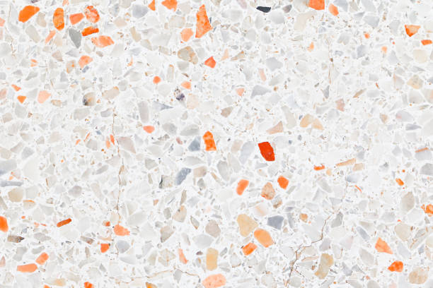 istock terrazzo flooring which has Orange rock Small or marble old. polished stone wall beautiful texture for background with copy space add text 1068772942