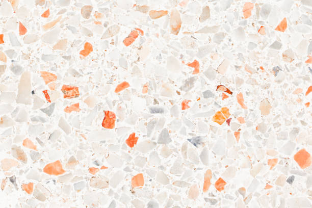 istock terrazzo flooring which has Orange rock Small or marble old. polished stone wall beautiful texture for background with copy space add text 1068772946