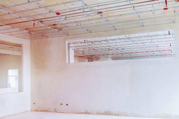 istock Working of metal frames structure  before installing gypsum boards interior Construction site 1068773478