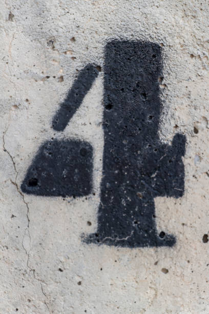istock number four painted stencil on concrete wall 1068775532