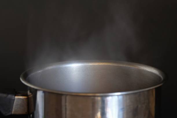 istock Smoke from the boiler on black background 1068778062