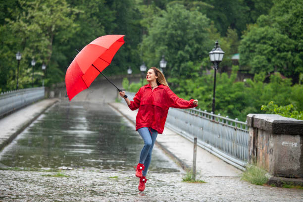 istock Beautiful girl with umbrella 1068778434