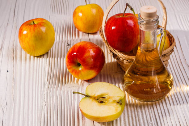 istock apple vinegar on a wooden rustic background 1068778816
