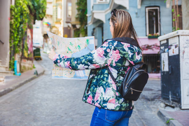 istock Travel woman with city map 1068781124