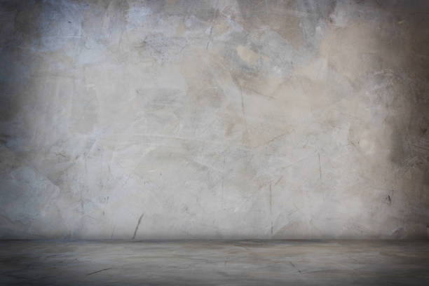 istock dark black and gray studio room banner and blank cement and concrete background 1068781166