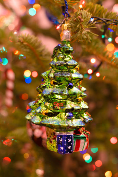 istock Christmas ornament decorated tree on natural tree with bokeh lights background 1068782648