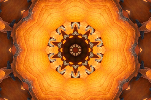 Orange pumpkins through kaleidoscope lens.