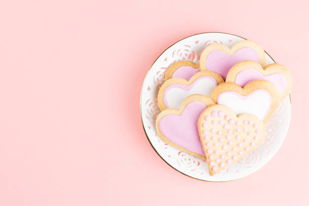 istock Valentine's day cookies close up on pink background. 1068793720