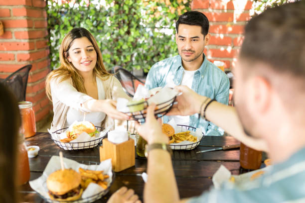 istock Friends Having Meal Together During Weekend 1068794930