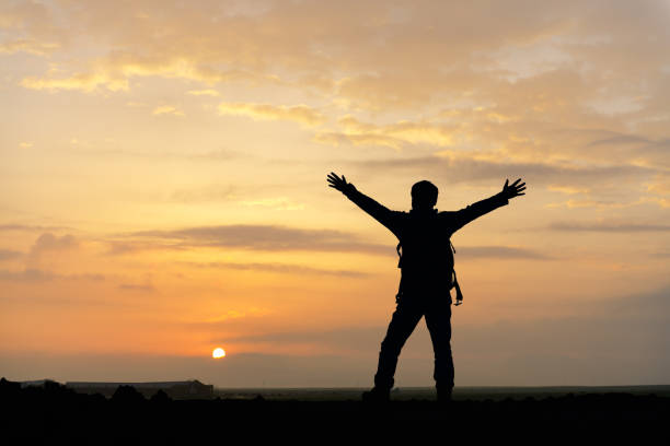 istock Lonely man standing on landscape 1068797262