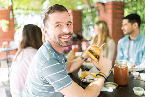 istock Happy To Have Mouthwatering Burger 1068797304