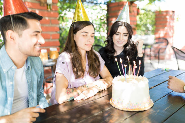 istock Making Wish In Front Of Birthday Cake 1068797360