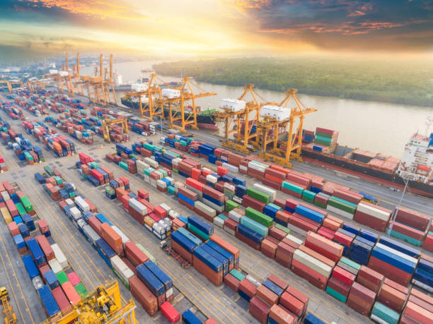istock Logistics and transportation of Container Cargo ship and Cargo working crane bridge in shipyard 1068797876