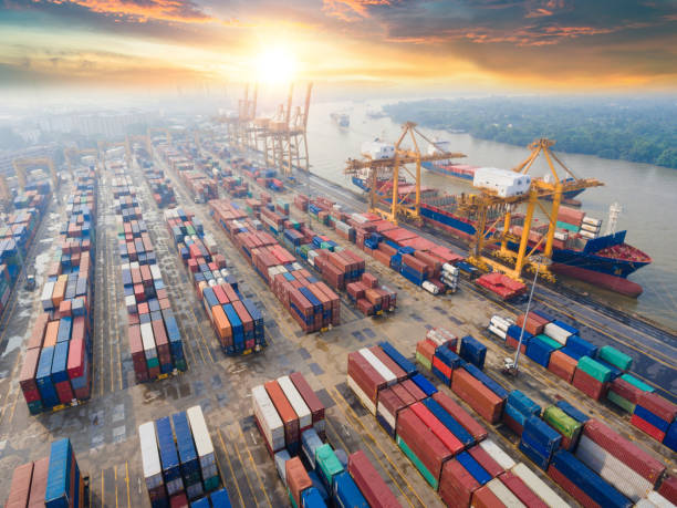istock Logistics and transportation of Container Cargo ship and Cargo working crane bridge in shipyard 1068797912