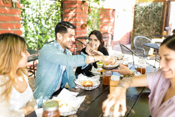 istock Pals Having Snacks During Social Gathering 1068798172