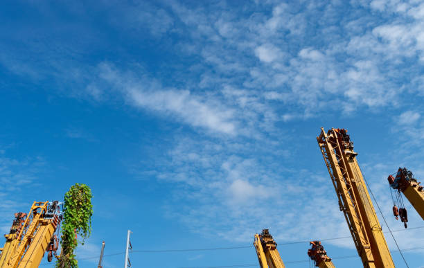istock crane truck, machine for construction and blue sky 1068798246