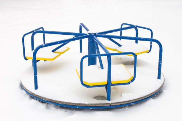 istock Children's carousel covered with snow in winter 1068806920