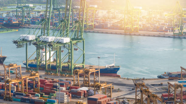 istock Logistics and transportation of Container Cargo ship and Cargo working crane bridge in shipyard 1068807694