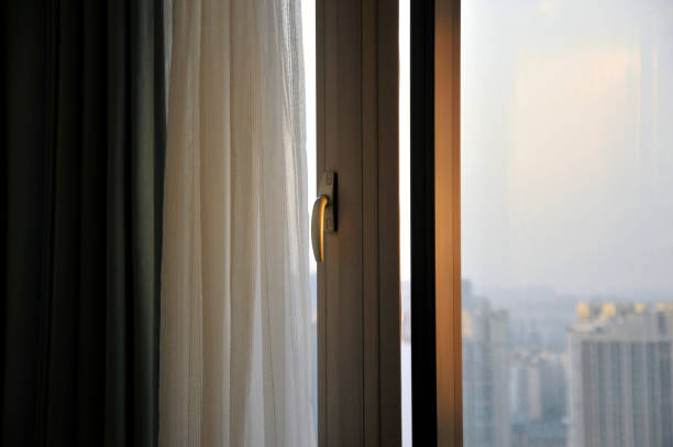 istock Curtain and window in sunrise background 1068808106