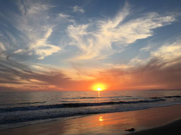 istock Liquid sun melts into the sea 1068811844