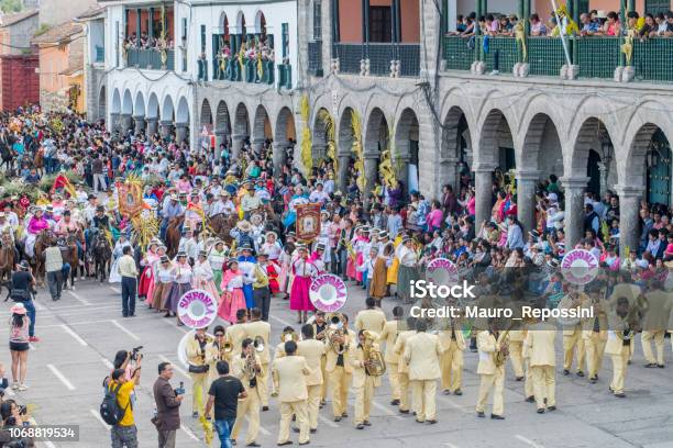 People With Multicolored Dresses And Hats And A Marching Band During The Celebration Of The Palm Sunday Of Easter At Ayacucho City Peru Stock Photo - Download Image Now