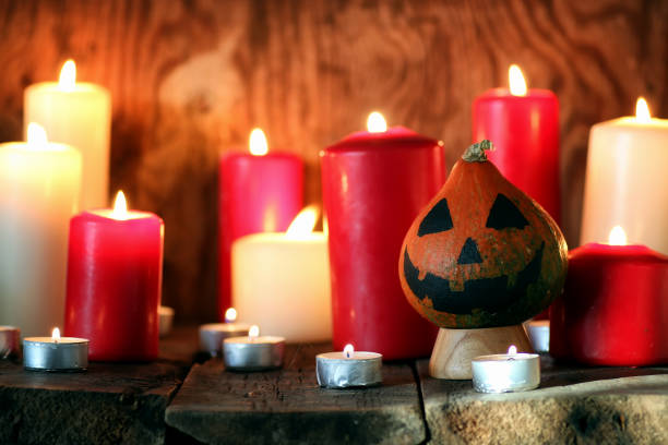istock pumpkin head and candles decor 1068824512