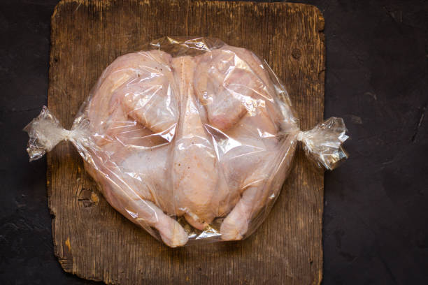 istock raw chicken - whole roasted chicken (chicken meat). Top view with copy space 1068824744
