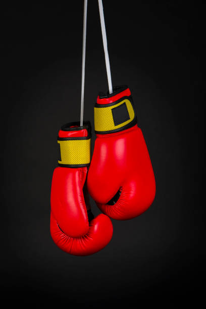 istock red boxing gloves on black background 1068825758