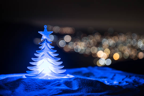 istock Christmas holiday blinking abstract background with decorated christmas tree 1068825794