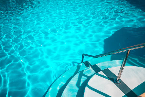 istock Swimming pool with white stairs in the hotel. 1068828356