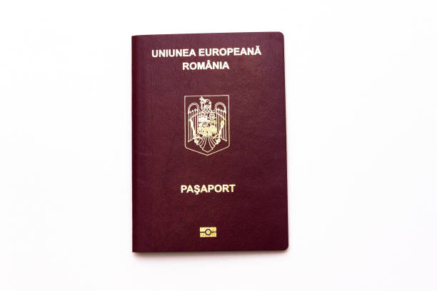 istock Romanian international passport isolated on white background. 1068830758