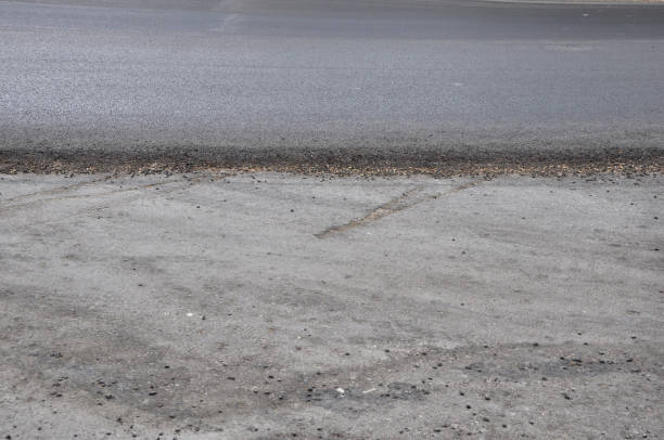 istock Asphalt edge between new and lower areas 1068837328