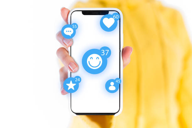 istock The smart phone on the human hands with social network icons. 1068838006