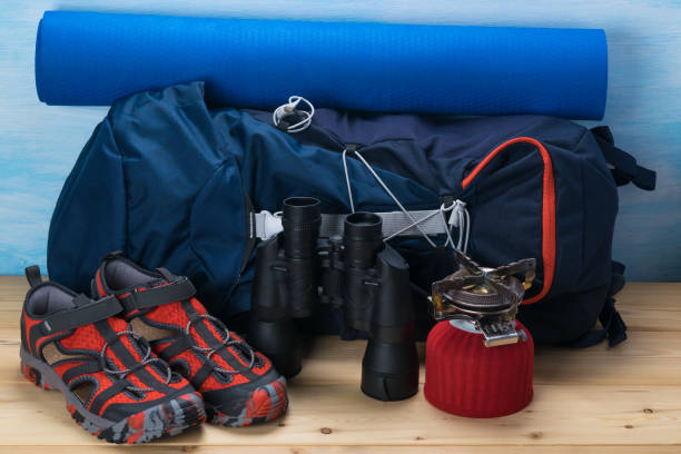 istock backpack and things for climbing in the mountains, background close-up 1068841222