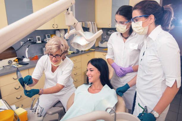 istock Dentist holding patient's orthopantogram 1068841354