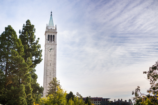 Sather tower (the Campanile) on a cloudy sky background, UC Berkeley, California, San Francisco bay