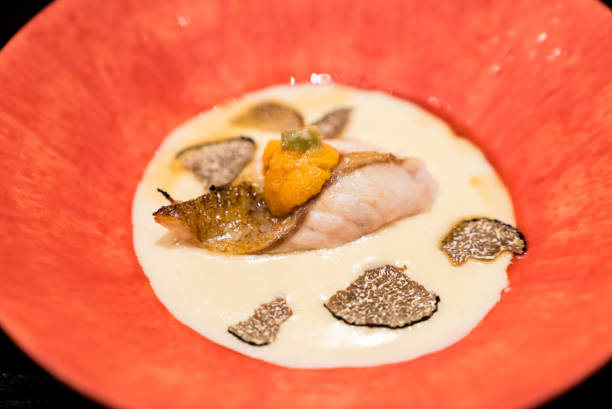 Grill Seabass with sea urchin Grilled dish : Grilled rosy seabass with sea urchin in creamy truffle snapper head stock pictures, royalty-free photos & images
