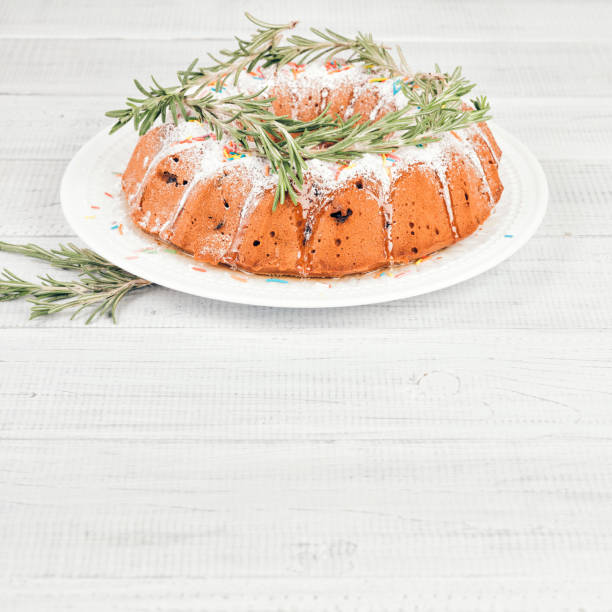 Traditional Christmas fruit cake on a white wooden table
