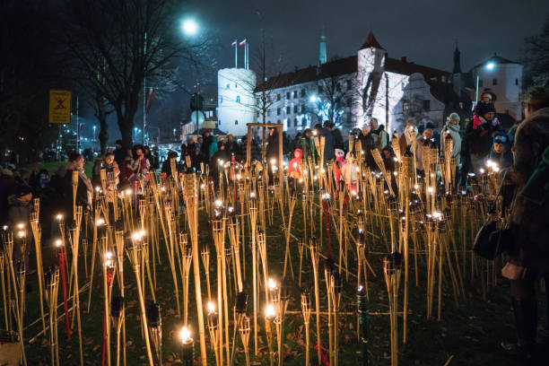 11th of November - Lacplesis Day Riga, Latvia - November 11, 2018: People placed candles Lacplesis Day on the presidential palace wall. 'Lacplesa day' commemorates latvians who fell defending Riga in the end of WWI. candlemas stock pictures, royalty-free photos & images