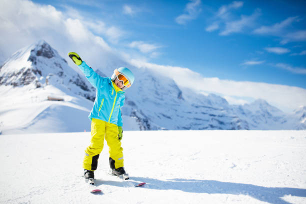 istock Ski and snow winter fun for kids. Children skiing. 1068857038