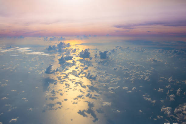 istock Ocean at sunset or sunrise, view from airplane 1068858298