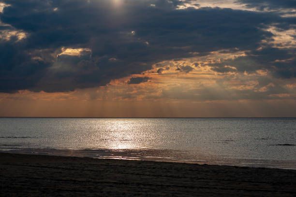 istock sea beach skyline with clouds and calm water 1068861084