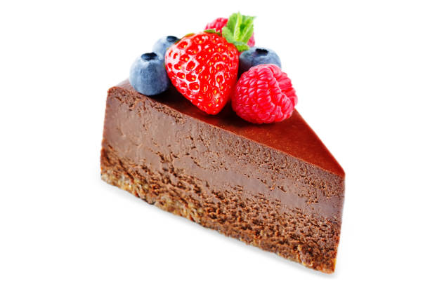 istock Chocolate cheesecake with fresh berries and mint leaves isolated 1068869000