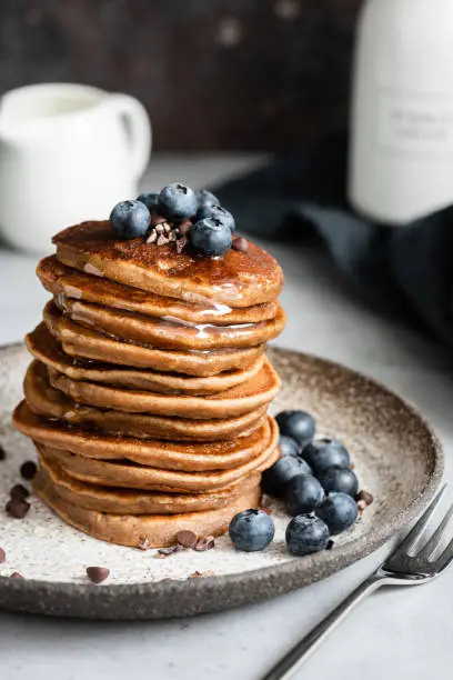 Photo of Stack of buckwheat pancakes with blueberries