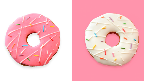 Layout of pink and white donuts. Set of two colorful donuts isolated on a white background. View from above.