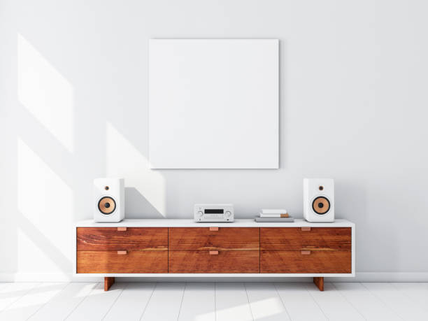 istock Square white canvas Mockup hanging on the wall, hi fi micro system on bureau 1068872238