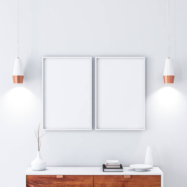 istock Two White poster Frames hanging on the wall in modern interior 1068872244