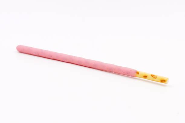 istock Biscuit sticks coated with strawberry flavour confectionery 1068874474