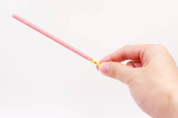 istock Biscuit sticks coated with strawberry flavour confectionery 1068874762